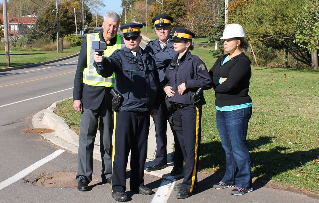 Police officers and mayor with radar